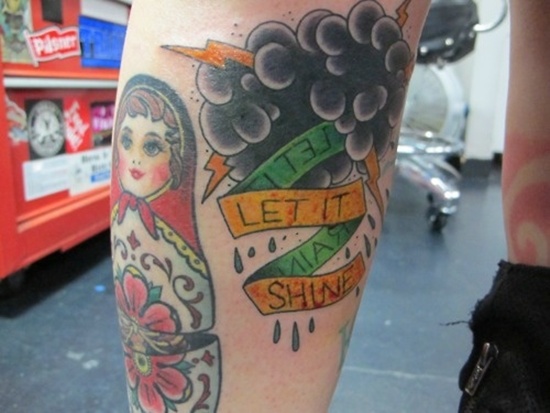 baby-face-rain-tattoo-design-for-men-on-arm