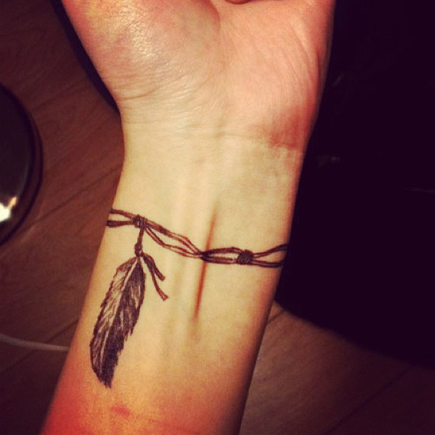 Very-Cool-Feather-Bracelet-Tattoo-Design-for-women
